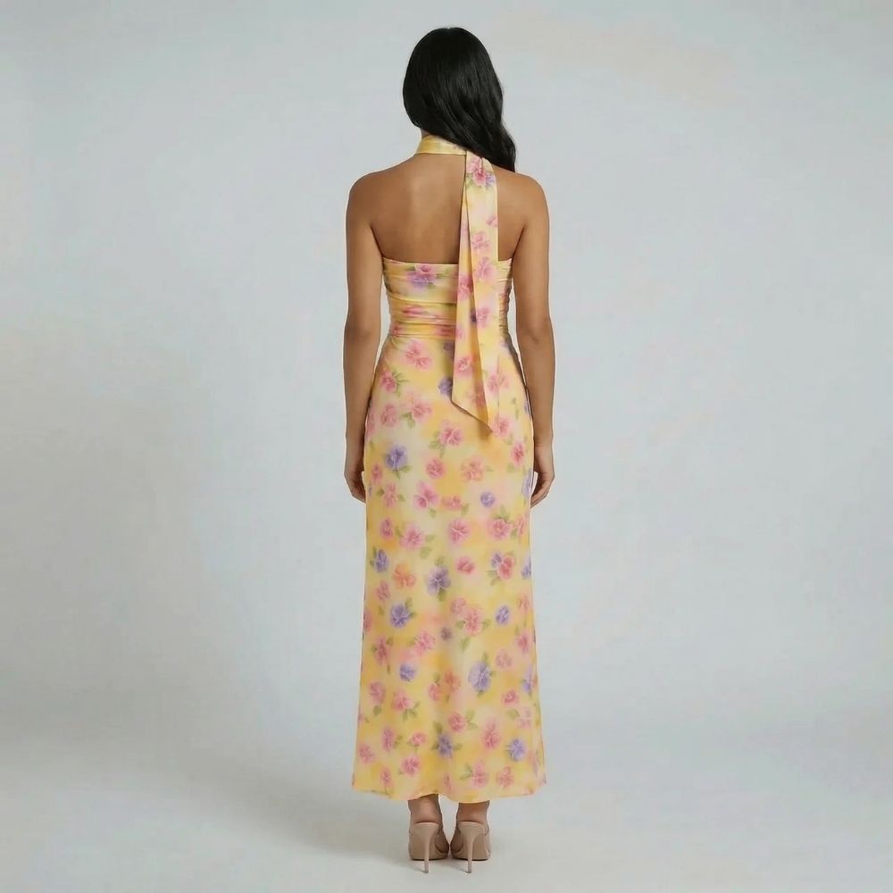 Yellow floral scarf maxi dress — back view highlighting flowing back detail and open-back design.