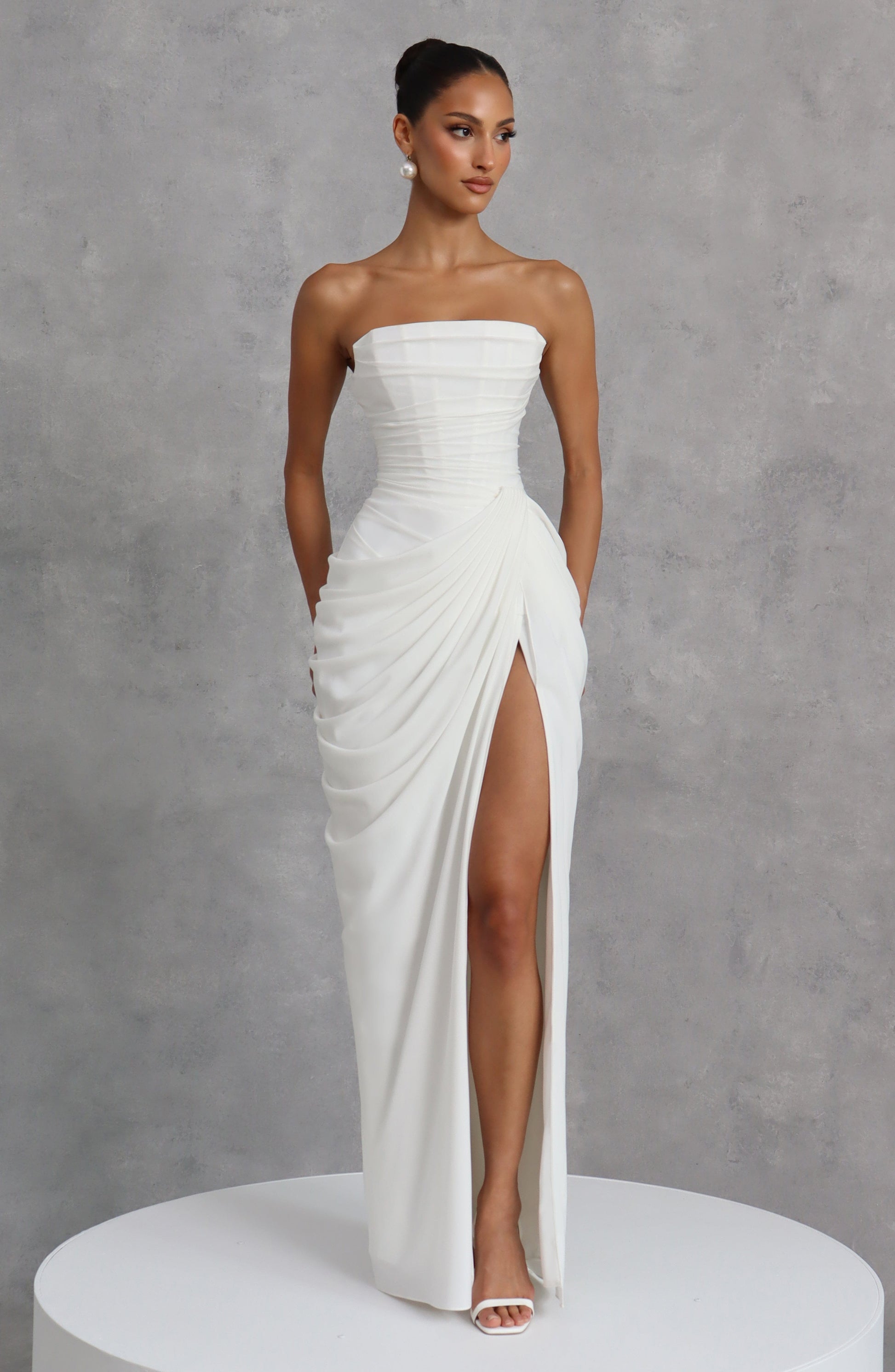 Women ivory strapless maxi dress, side view