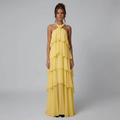 Front view of a vibrant yellow ruffled halter maxi dress, perfect for a wedding or special occasion.