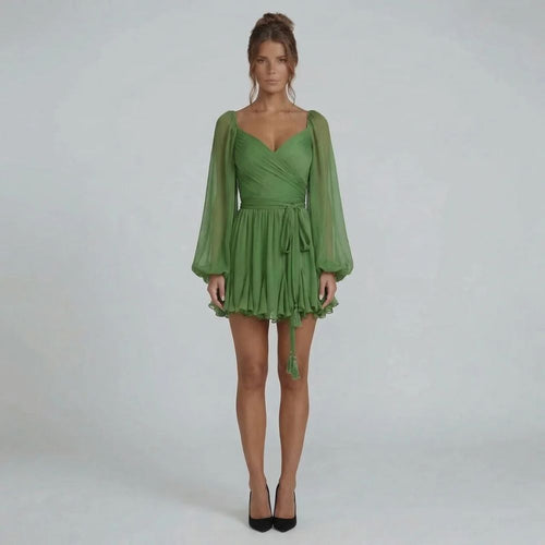 Green chiffon mini dress with sweetheart neckline and ruffled hem — front view.