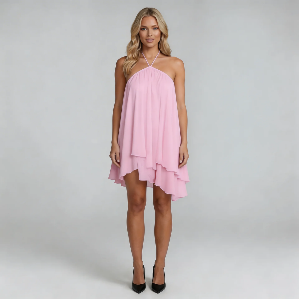 Pink flowy halter mini dress with adjustable halter neckline — close-up of layered ruffles