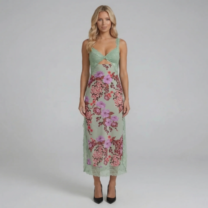 Green floral lace midi dress — front view showing romantic lace and flowing floral skirt.