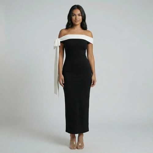 Black off-shoulder maxi dress with white bow detail — front view showing full-length sculpted silhouette.
