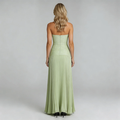 Sage pleated strapless maxi dress — back view showing zipper closure and elegant drape.