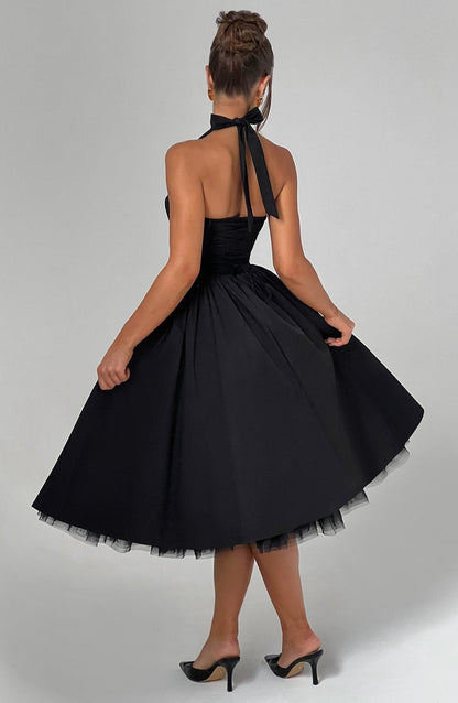 Women black halter midi dress, side view
