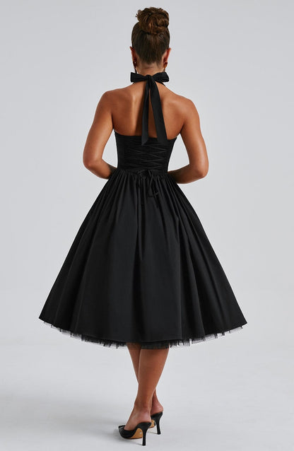 Women black halter midi dress, side view