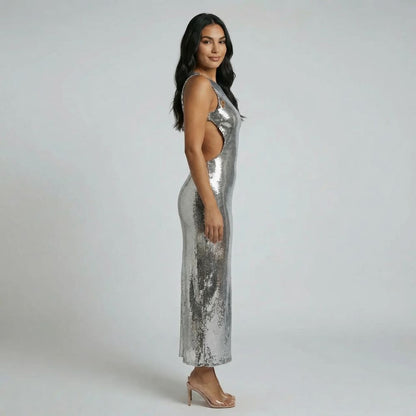 Silver sequin maxi dress with side cutouts — side profile showing tailored silhouette
