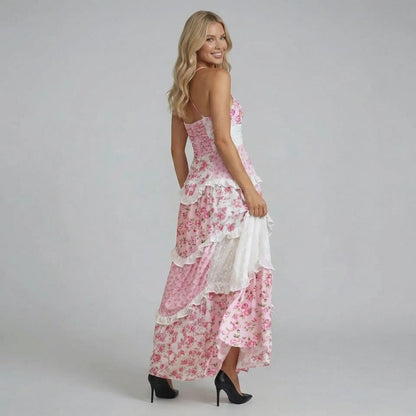 Pink floral tiered maxi dress with cross-back adjustable straps — back view showing straps and waist ruching
