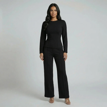 Black tailored outfit — full set styled with heels for an elegant yet structured look.