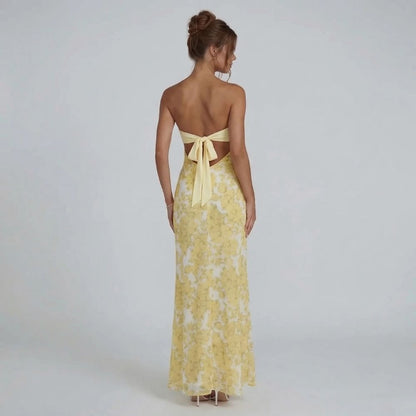 Yellow strapless cutout maxi dress — back view showing bow detail