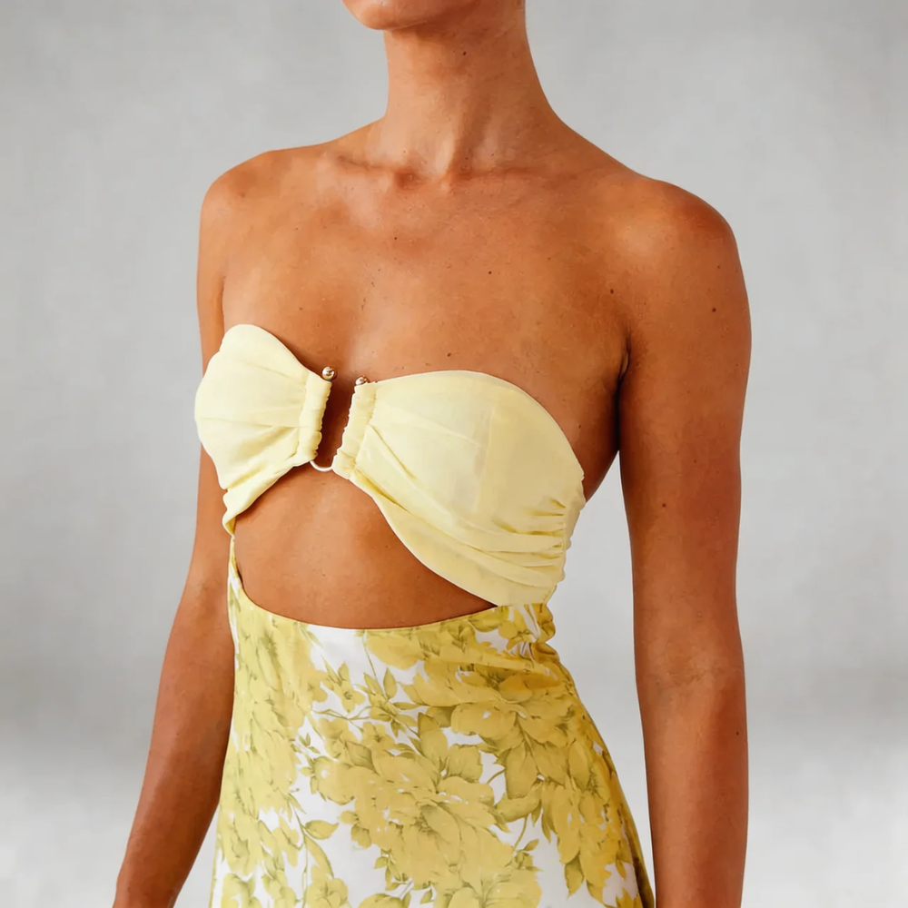 Yellow floral cutout maxi dress — close-up of bandeau bodice and waist cutout