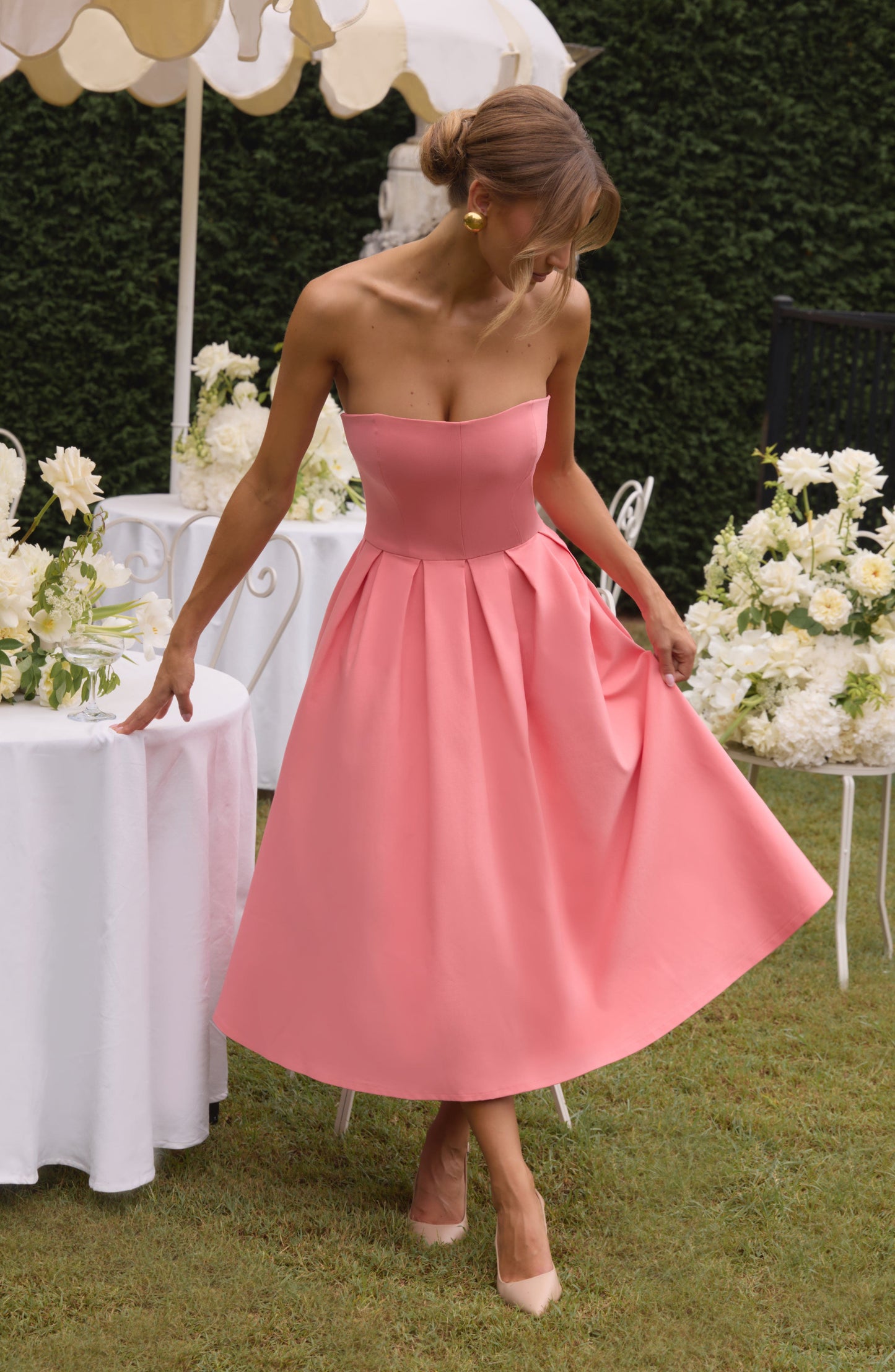 Women pink strapless midi dress, back view