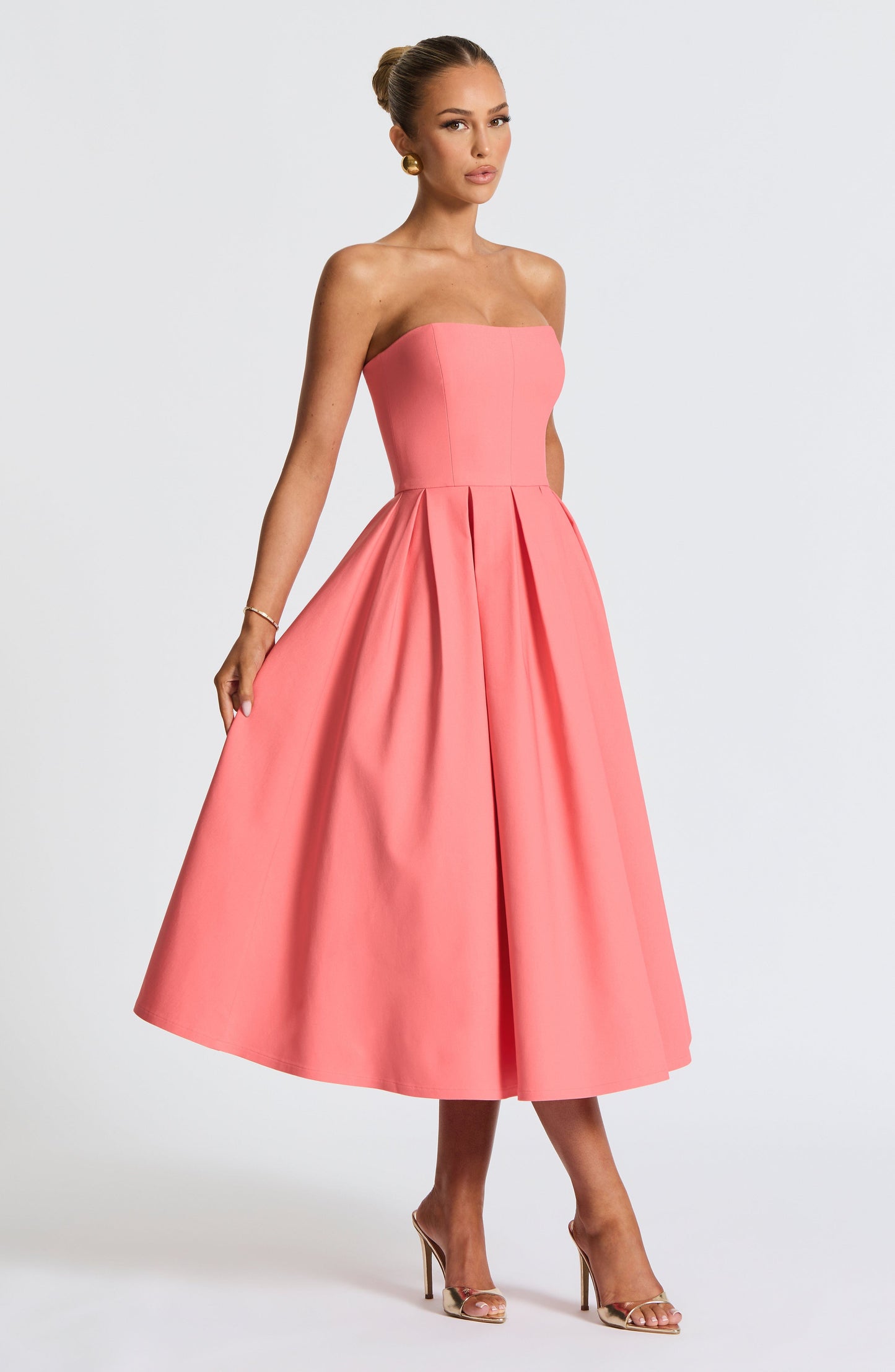 Women pink strapless midi dress, side view