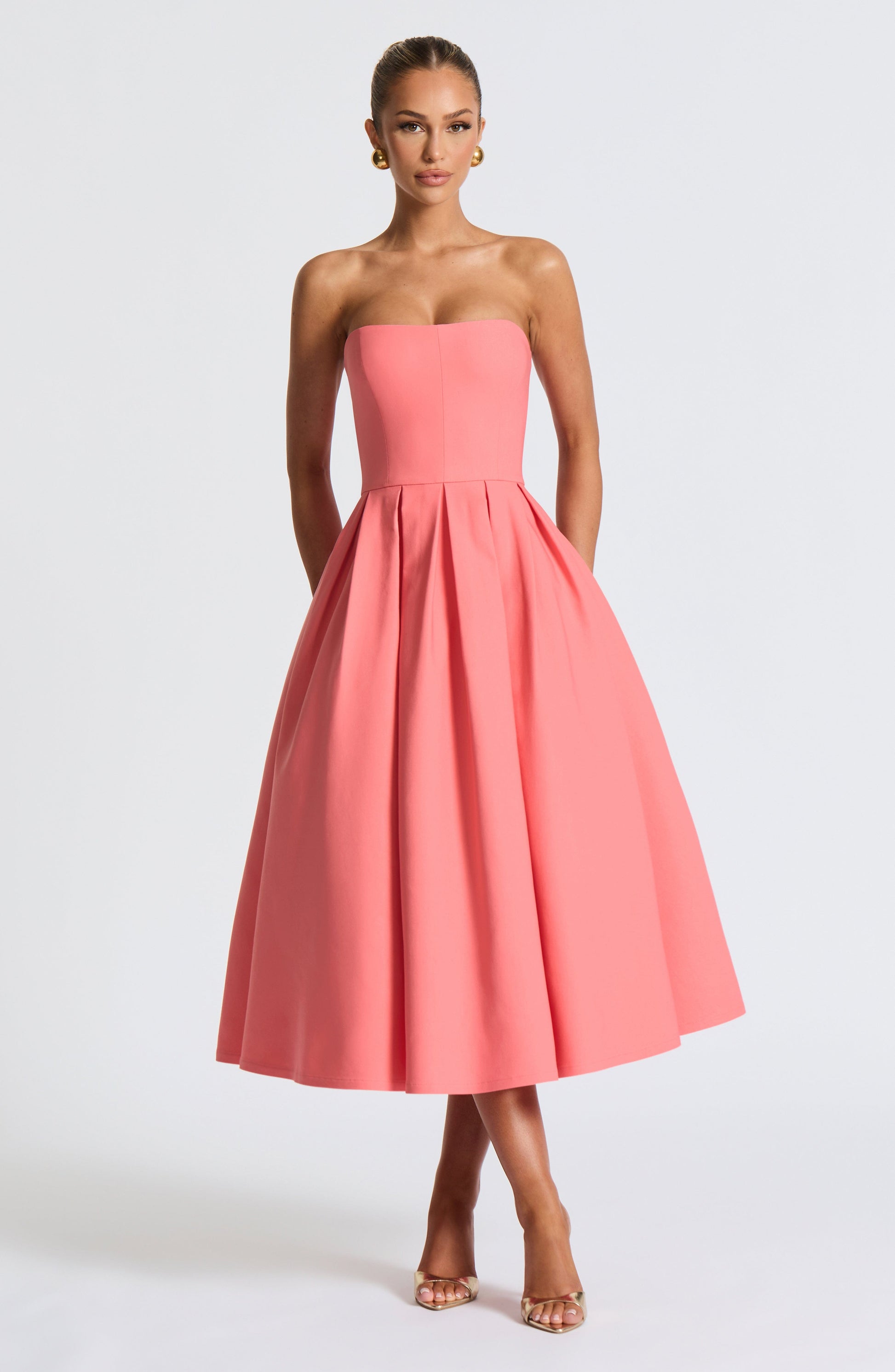 Women pink strapless midi dress, side view