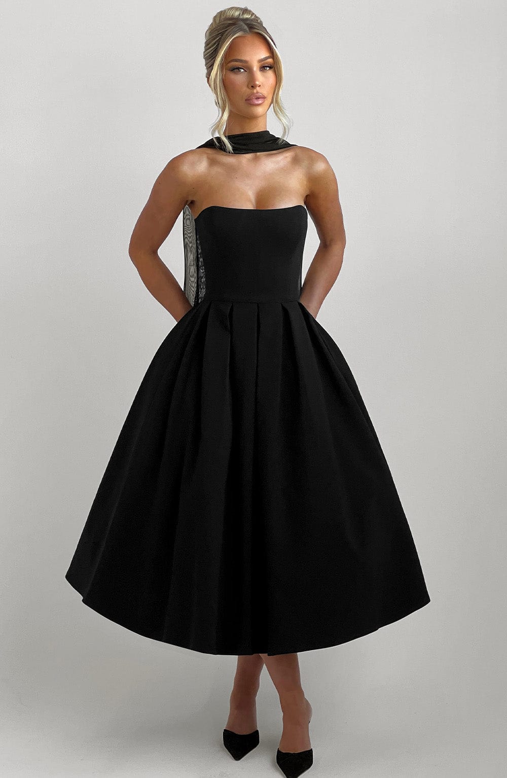 Women black strapless midi dress, back view
