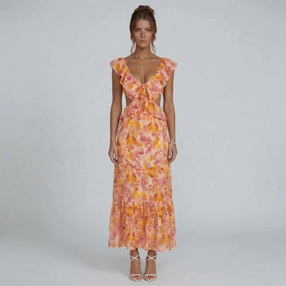 Orange watercolor ruffle maxi dress with tiered hem — front view showcasing neckline and full length