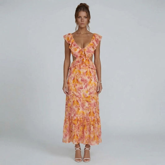 Orange watercolor ruffle maxi dress with tiered hem — front view showcasing neckline and full length